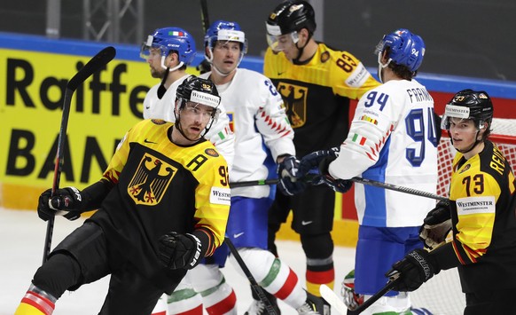 Germany&#039;s Marcel Noebels, left, celebrates after scoring his side&#039;s fifth goal during the Ice Hockey World Championship group B match between Germany and Italy at the Arena in Riga, Latvia,  ...