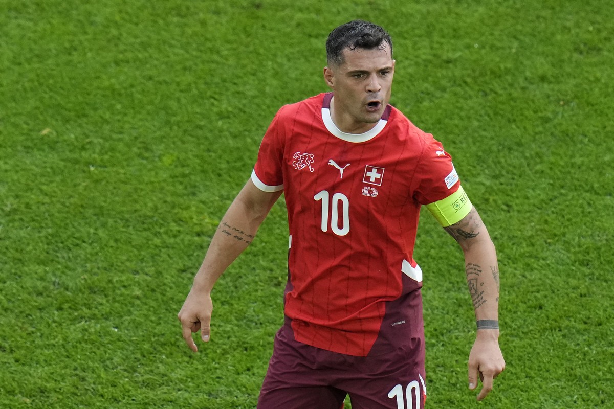 Switzerland's Granit Xhaka reacts during a quarterfinal match between England and Switzerland at the Euro 2024 soccer tournament in Duesseldorf, Germany, Saturday, July 6, 2024. (AP Photo/Hassan  ...