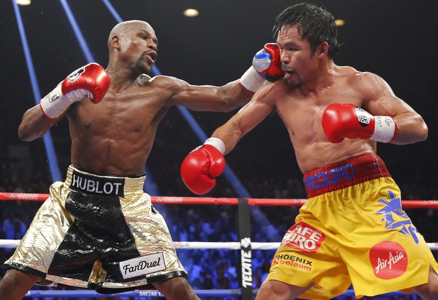 Floyd Mayweather (links) und Manny Pacquiao sind durch ihren Kampf im Mai 2015 sehr, sehr reich geworden.