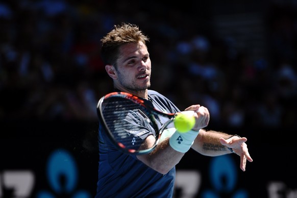 epa06442162 Stan Wawrinka of Switzerland in action against Ricardas Berankis of Lithuania during round one of the Australian Open tennis tournament in Melbourne, Victoria, Australia, 16 January 2018.  ...