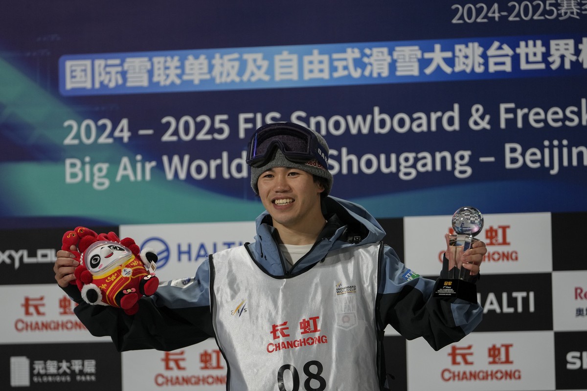 Hiroto Ogiwara of Japan celebrates on podium after winning in the men's Snowboard Big Air final during the FIS Snowboard &amp; Freeski World Cup 2025, at the Shougang Park in Beijing, Sunday, Dec ...