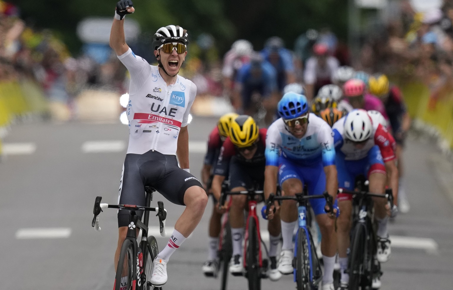 Slovenia&#039;s Tadej Pogacar, wearing the best young rider&#039;s white jersey celebrates as he crosses the finish line to win the sixth stage of the Tour de France cycling race over 220 kilometers ( ...