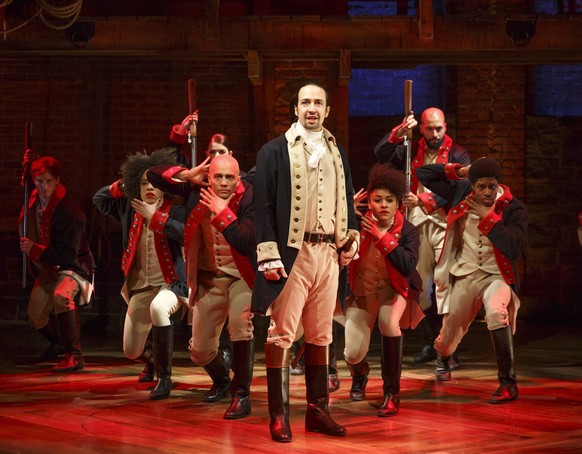 FILE - In this file photo released by The Public Theater, Lin-Manuel Miranda, foreground, performs with members of the cast of the musical &quot;Hamilton&quot; in New York. A group dedicated to studyi ...