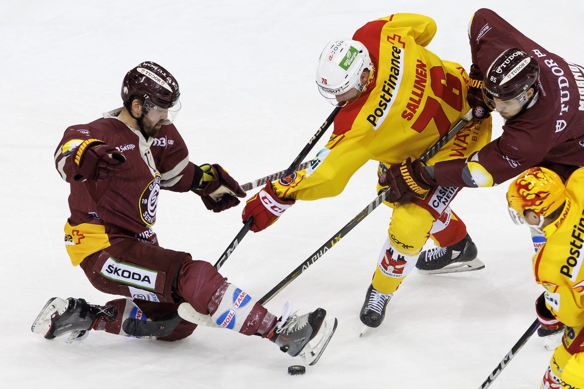 Biel's forward Jere Sallinen, centre, vies for the puck with Geneve-Servette's defender Arnaud Jacquemet, left, and Geneve-Servette's forward Marco Miranda, right, during the third leg  ...