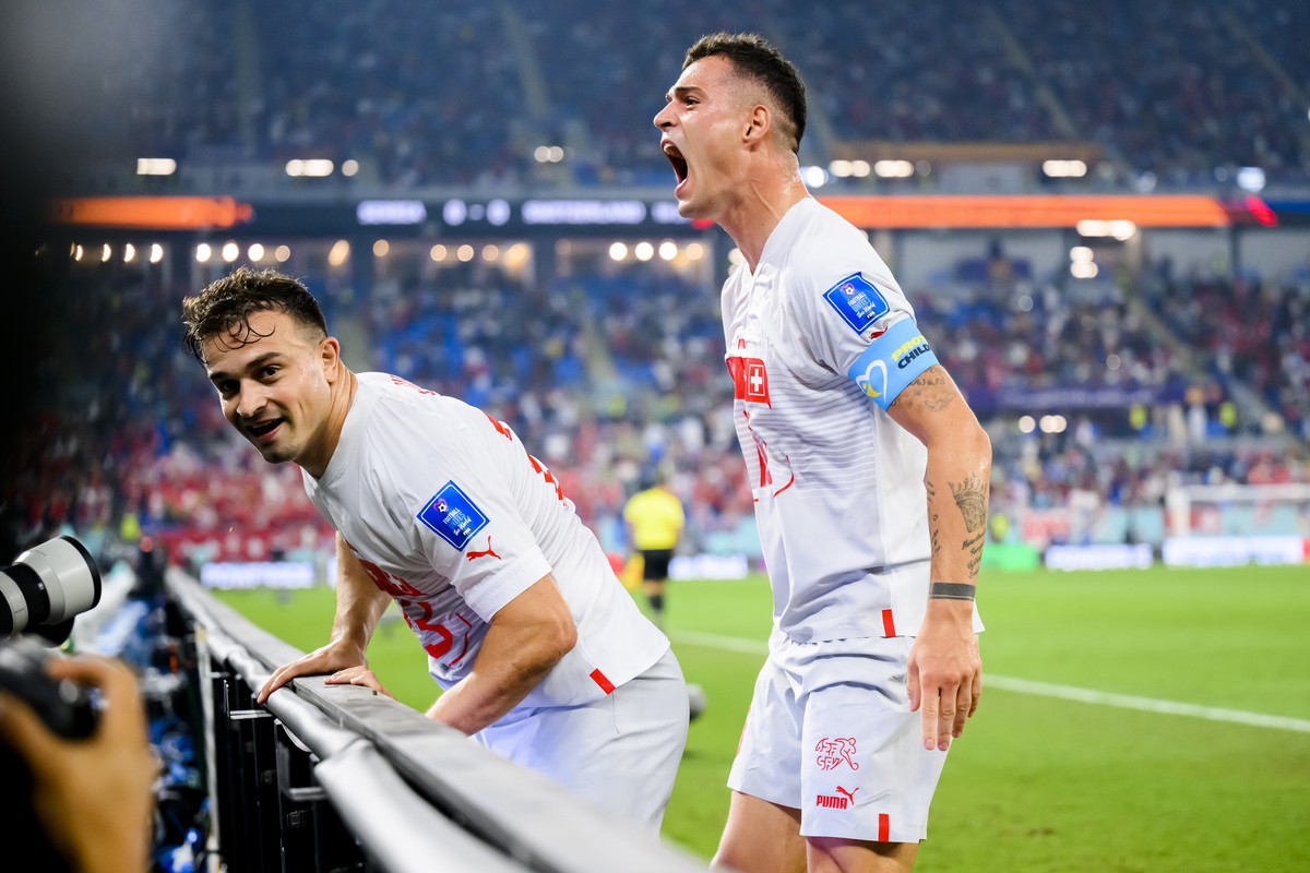 Switzerland's midfielder Xherdan Shaqiri, left, celebrates after scoring the first goal with Switzerland's midfielder Granit Xhaka, right, during the FIFA World Cup Qatar 2022 group G soccer ...