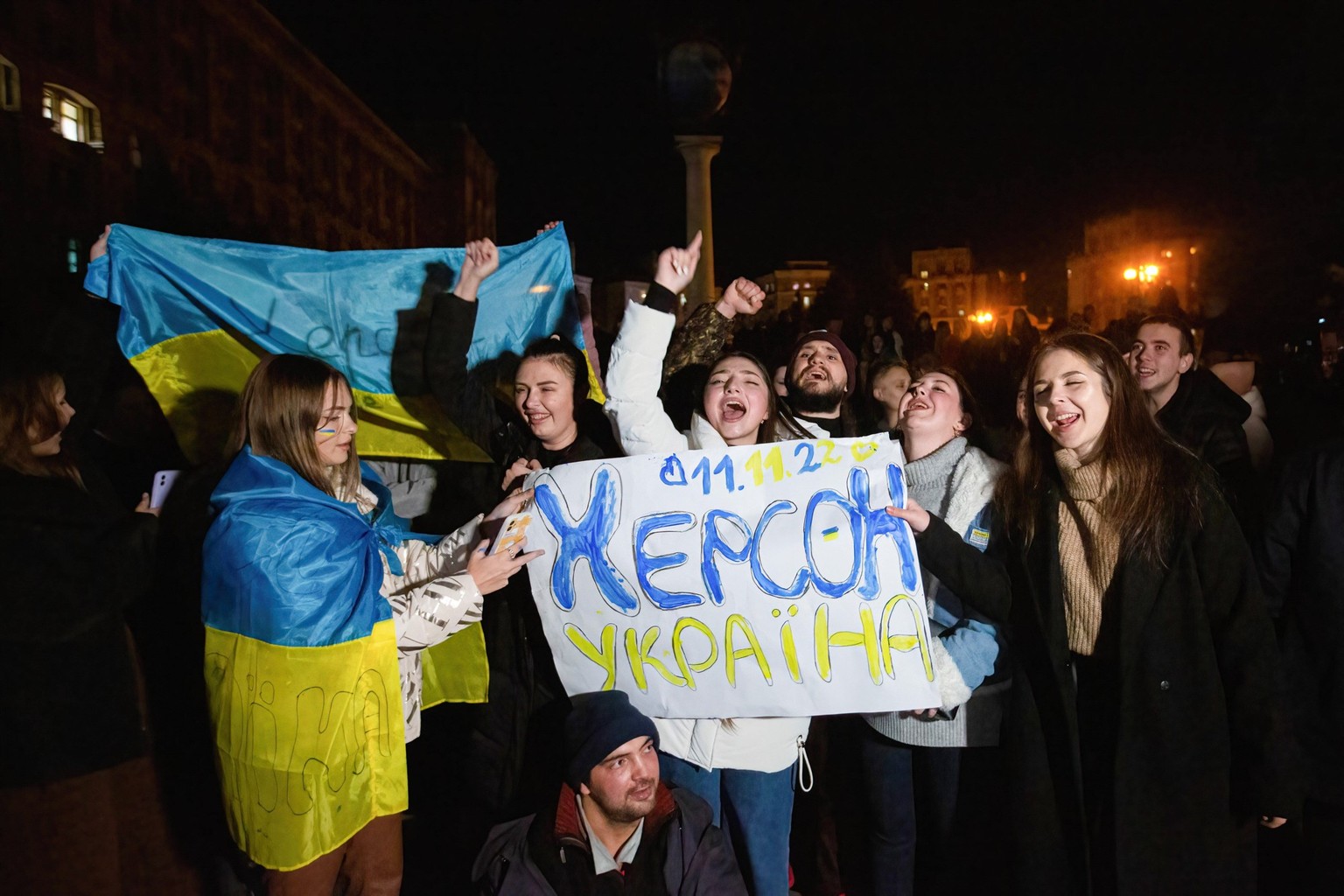 November 11, 2022, Kyiv, Ukraine: People hold a banner that says Kherson is Ukraine celebrating the liberation of Kherson from Russian occupiers in central Kyiv. Ukrainian armed forces liberated Khers ...