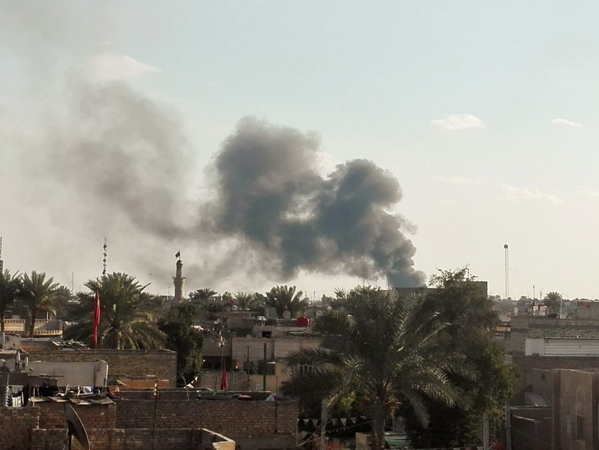 Smoke rises from the site of a suicide car bomb attack at a used cars dealers parking in Hayy al-Shurta, neighborhood in southern Baghdad, Iraq, February 16, 2017. REUTERS/Stringer EDITORIAL USE ONLY. ...