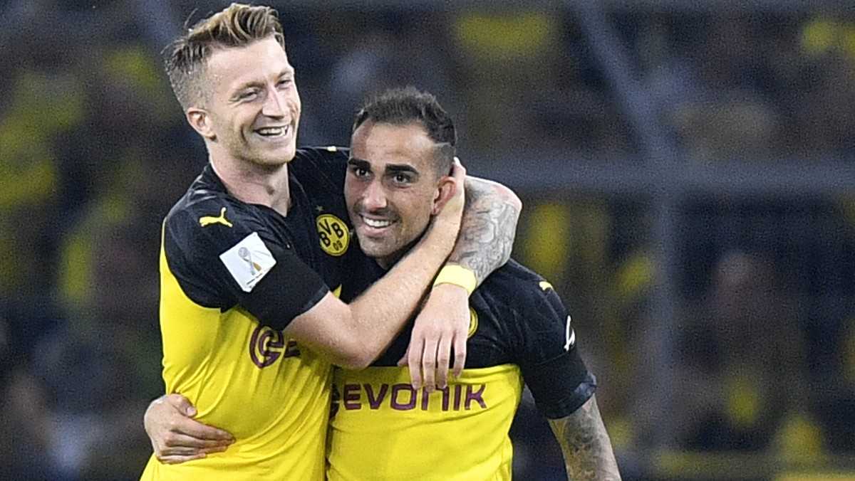 Dortmund's Paco Alcacer, second left, celebrates with Dortmund's Marco Reus after scoring his side's opening goal during the German Supercup final soccer match between Borussia Dortmund ...