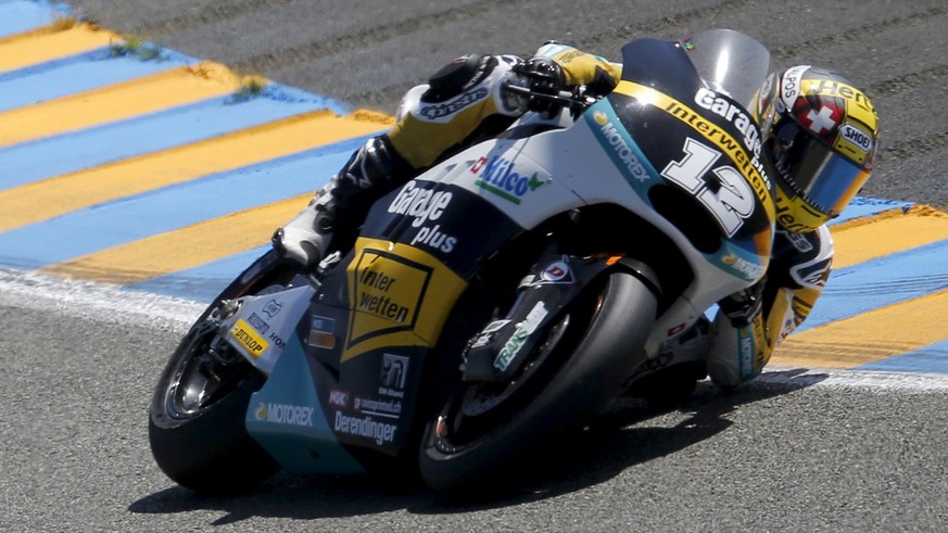 Kalex Moto2 rider Thomas Luthi of Switzerland rides his bike ahead of Kalex Moto2 rider Johann Zarco of France and Kalex rider Tito Rabat of Spain during the French Grand Prix at the Le Mans circuit,  ...