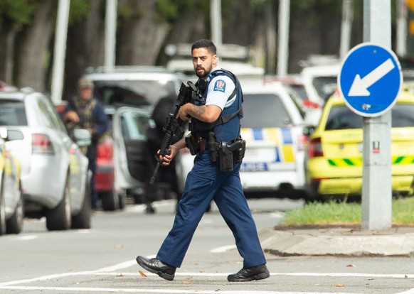 epa07438401 Armed police patrol following a shooting resulting in multiply fatalies and injuries at the Masjid Al Noor on Deans Avenue in Christchurch, New Zealand, 15 March 2019. According to media r ...