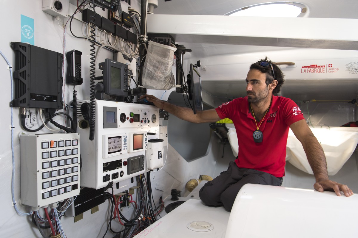 Swiss skipper Alan Roura works on his 60-foot monohull IMOCA "La Fabrique" SUI7 during a training session two months before the start of the Route du Rhum sailing race, at the western French ...