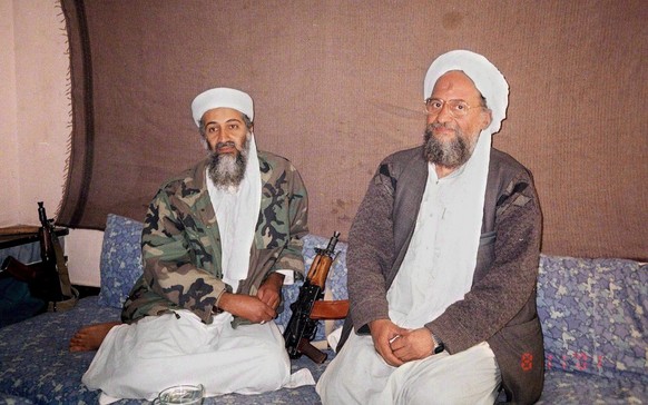 epa02781439 (FILE) An Ausaf newspaper photograph dated 08 November 2001 shows Saudi-dissident Osama bin Laden (L) sitting with his deputy Ayman al-Zawahiri at his hide out at an undisclosed location i ...