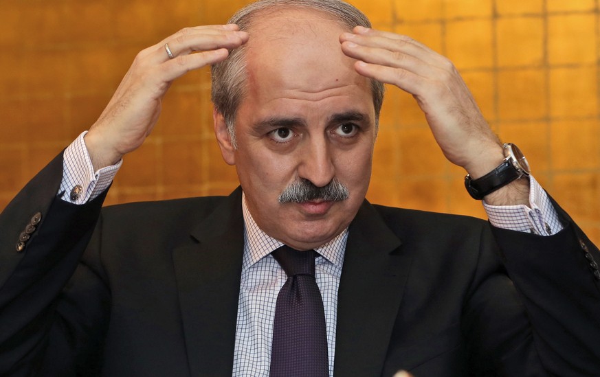 Numan Kurtulmus, deputy chairman of Turkey's ruling Justice and Development Party, AKP, speaks to the foreign media members in Ankara, Turkey, Tuesday, Jan. 21. 2014, amid a corruption scandal that ha ...