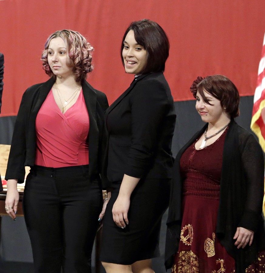 FILE - This Monday Feb. 24, 2014 file photo shows from left, Amanda Berry, Gina DeJesus and Michelle Knight introduced at the Performing Arts Center in Medina, Ohio. The three women held captive in a  ...