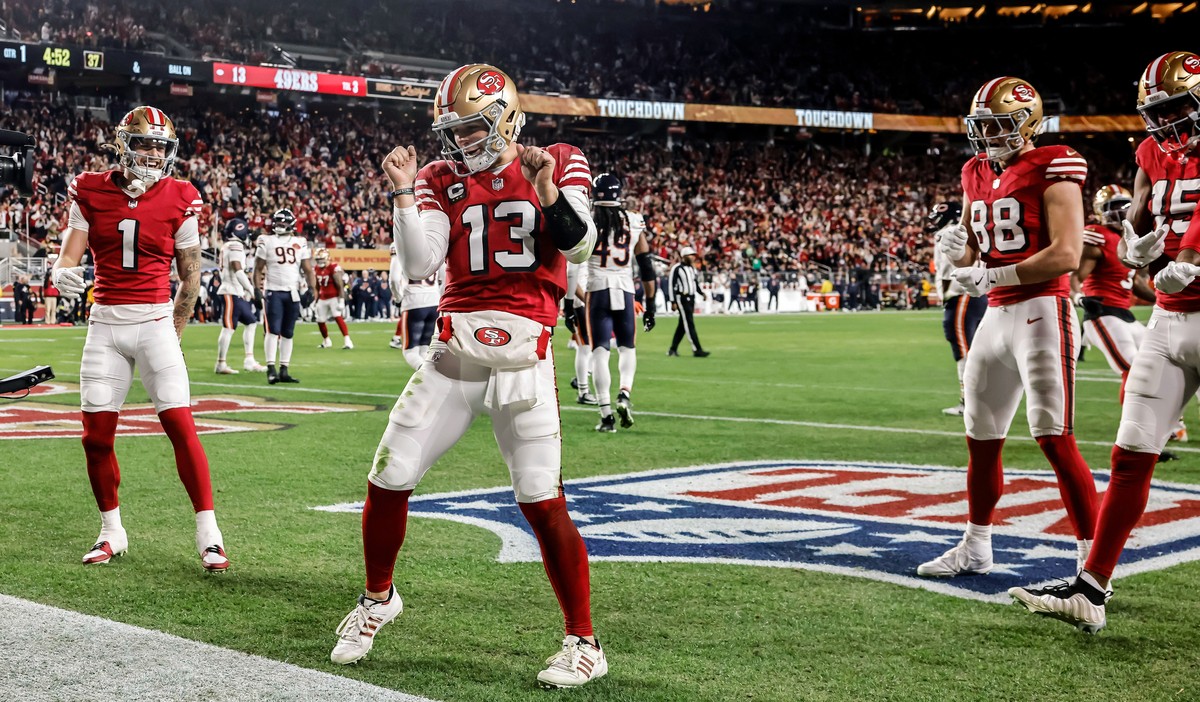 San Francisco 49ers' Brock Purdy (13) dances in the end zone after scoring a touchdown during the first half of an NFL football game against the Chicago Bears in Santa Clara, Calif., Sunday, Dec. ...