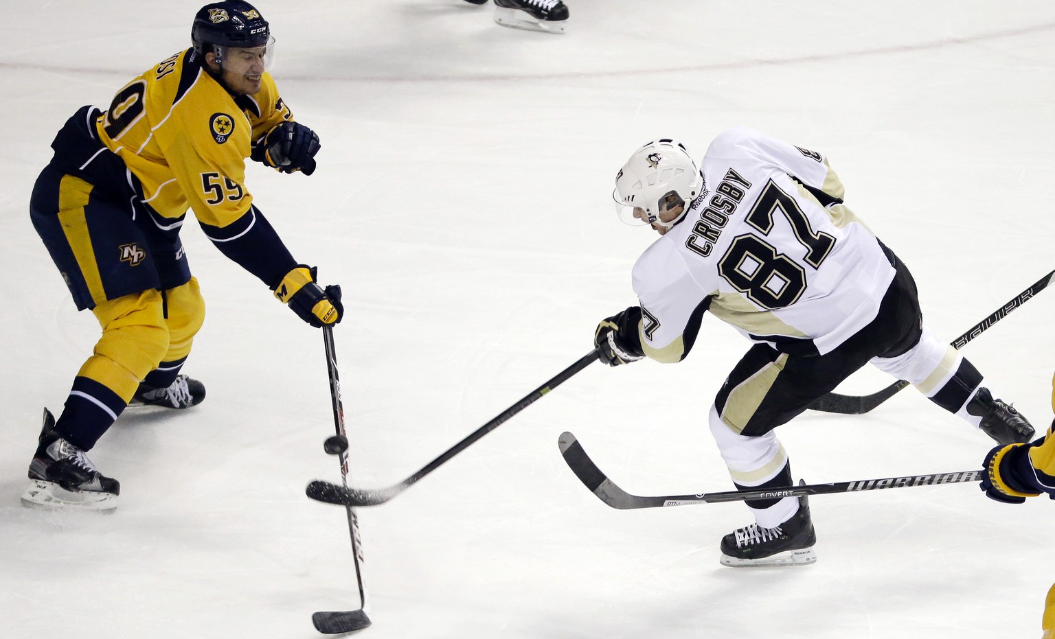 Nashville Predators defenseman Roman Josi (59), of Switzerland, blocks a shot by Pittsburgh Penguins center Sidney Crosby (87) in the first period of an NHL hockey game Tuesday, March 4, 2014, in Nash ...