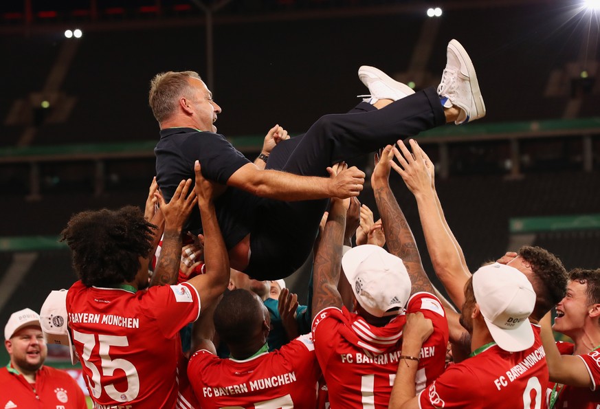 epa08527827 Bayern Munich players celebrate with their coach Hansi Flick (up) after winning the German DFB Cup final between Bayer 04 Leverkusen and FC Bayern Munich at Olympic Stadium in Berlin, Germ ...