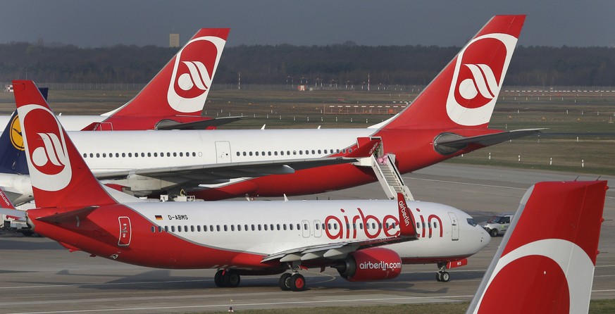 FILE - In this April 2, 2014 file photo airplanes of the German airline &#039;Air Berlin&#039; are pictured at the Tegel airport in Berlin, Germany. Air Berlin had to caoncel dozens of flights on Tues ...