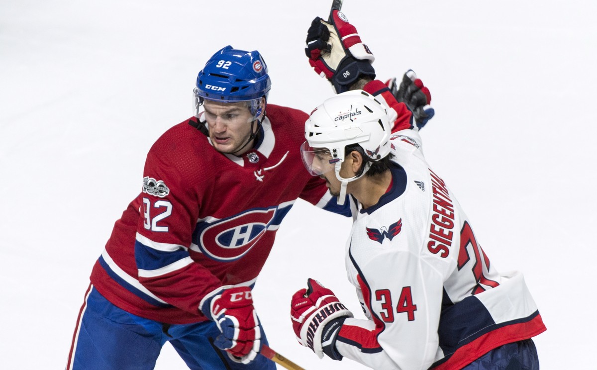 Washington Capitals' Jonas Siegenthaler is stopped by Montreal Canadiens' Jonathan Drouin during the first period of a preseason NHL hockey game, Wednesday, Sept. 20, 2017 in Montreal. (Paul ...