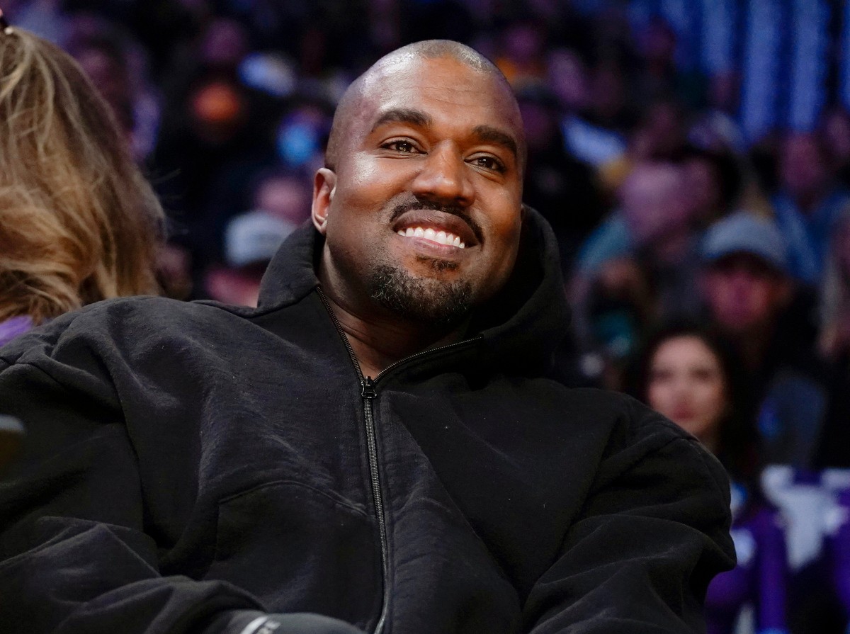 FILE - Kanye West, known as Ye, watches the first half of an NBA basketball game between the Washington Wizards and the Los Angeles Lakers, on March 11, 2022, in Los Angeles. (AP Photo/Ashley Landis,  ...