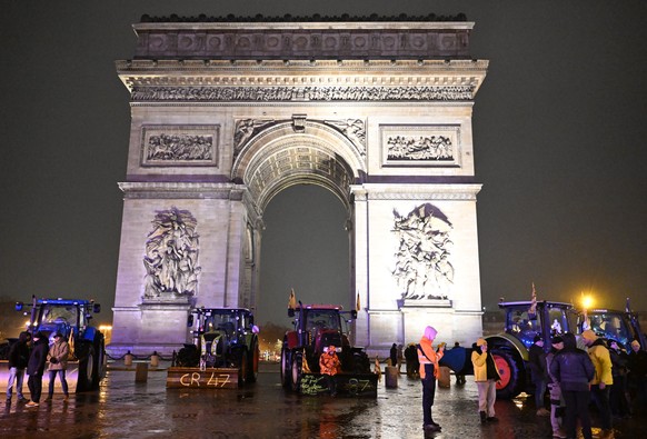 French farmers park their tractor in front of the Arc de Triomphe to protest against the Mercosur trade alliance with South America countries but also EU farming policy or mass cull of cows ordered to ...