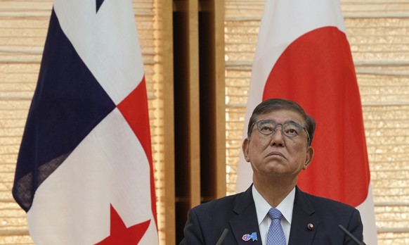 Japan&#039;s Prime Minister Shigeru Ishiba listens as Panama&#039;s President Jose Raul Mulino delivers a speech during their joint announcement after their meeting at the prime minister&#039;s office ...