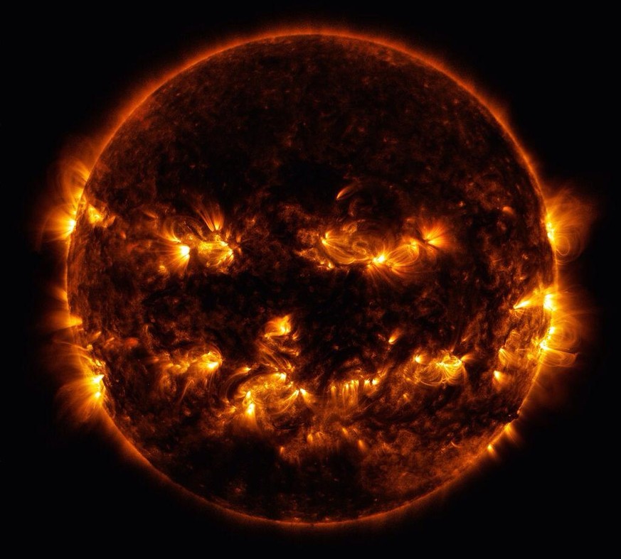 Active regions on the sun combined to look something like a jack-o-lantern’s face on Oct. 8, 2014. The active regions appear brighter because those are areas that emit more light and energy — markers  ...