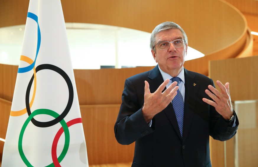 epa08320934 Thomas Bach, president of the International Olympic Committee (IOC), attends an interview after the decision to postpone the Tokyo 2020 Olympic Games because of the coronavirus disease (CO ...