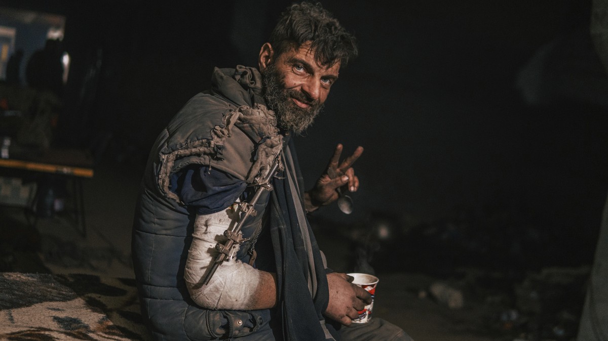 FILE - In this photo provided by Azov Special Forces Regiment of the Ukrainian National Guard Press Office, an Azov Special Forces Regiment's serviceman, injured during fighting against Russian f ...