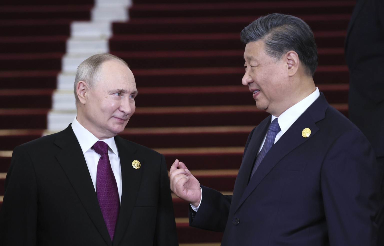 Russian President Vladimir Putin, left, and Chinese President Xi Jinping talk during their meeting on the sidelines of the Belt and Road Forum in Beijing, China, on Tuesday, Oct. 17, 2023. (Sergey Sav ...