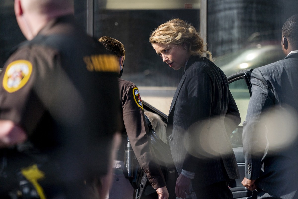 epa09885165 American actress Amber Heard departs the courthouse following the first day of Depp v Heard at the Fairfax County Courthouse in Fairfax, Virginia, USA, 11 April 2022. Johnny Depp's 50 ...