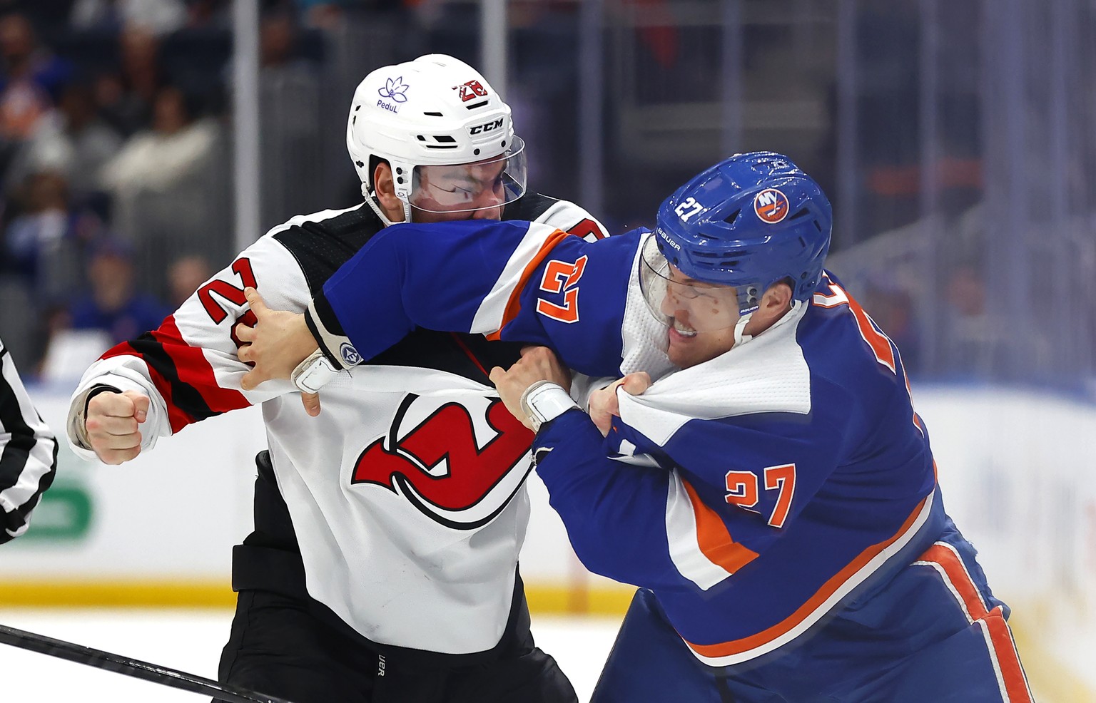 New York Islanders left wing Anders Lee and New Jersey Devils right wing Timo Meier fight during the second period of an NHL hockey game, Sunday, March 24, 2024, in Elmont, New York. (AP Photo/Noah K. ...