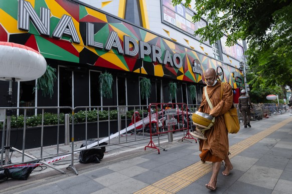 A Buddhist monk walks outside the music bar where a fire killed a number of people in Bangkok, Thailand, Tuesday, July 14, 2026. (AP Photo/Wason Wanichakorn)
Thailand Fire