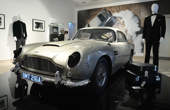 epa10207031 An Aston Martin DB5 stunt car from the film &#039;No Time To Die&#039; is displayed during a media preview of 60 years of James Bond at Christies Auction House in London, Britain 26 Septem ...