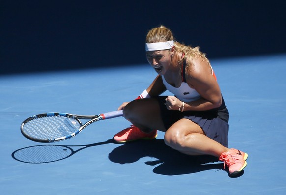 epa05729445 Dominika Cibulkova of Slovakia drops to court as she makes a fist and screams in triumph as she wins against Hsieh Su-Wei of Taiwan during round two of the Women&#039;s Singles at the Aust ...