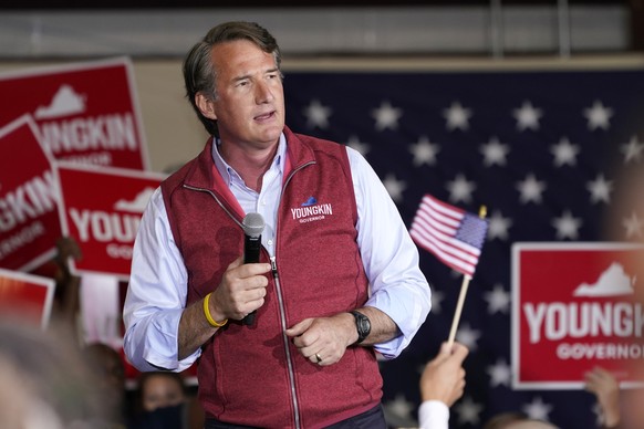 Republican gubernatorial candidate Glenn Youngkin gestures as he speaks to supporters during a rally in Chesterfield, Va., Monday, Nov. 1, 2021. Youngkin will face Democrat former Gov. Terry McAuliffe ...