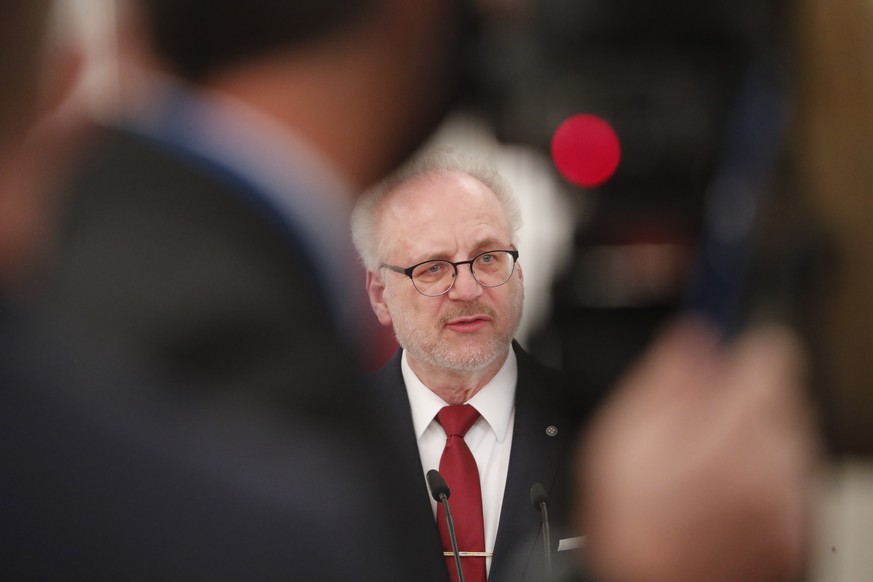 epa09611210 Latvian President Egils Levits delivering a statement during press conference after his meeting with NATO Secretary General in Riga, Latvia, 29 November 2021. Jens Stoltenberg will attend  ...