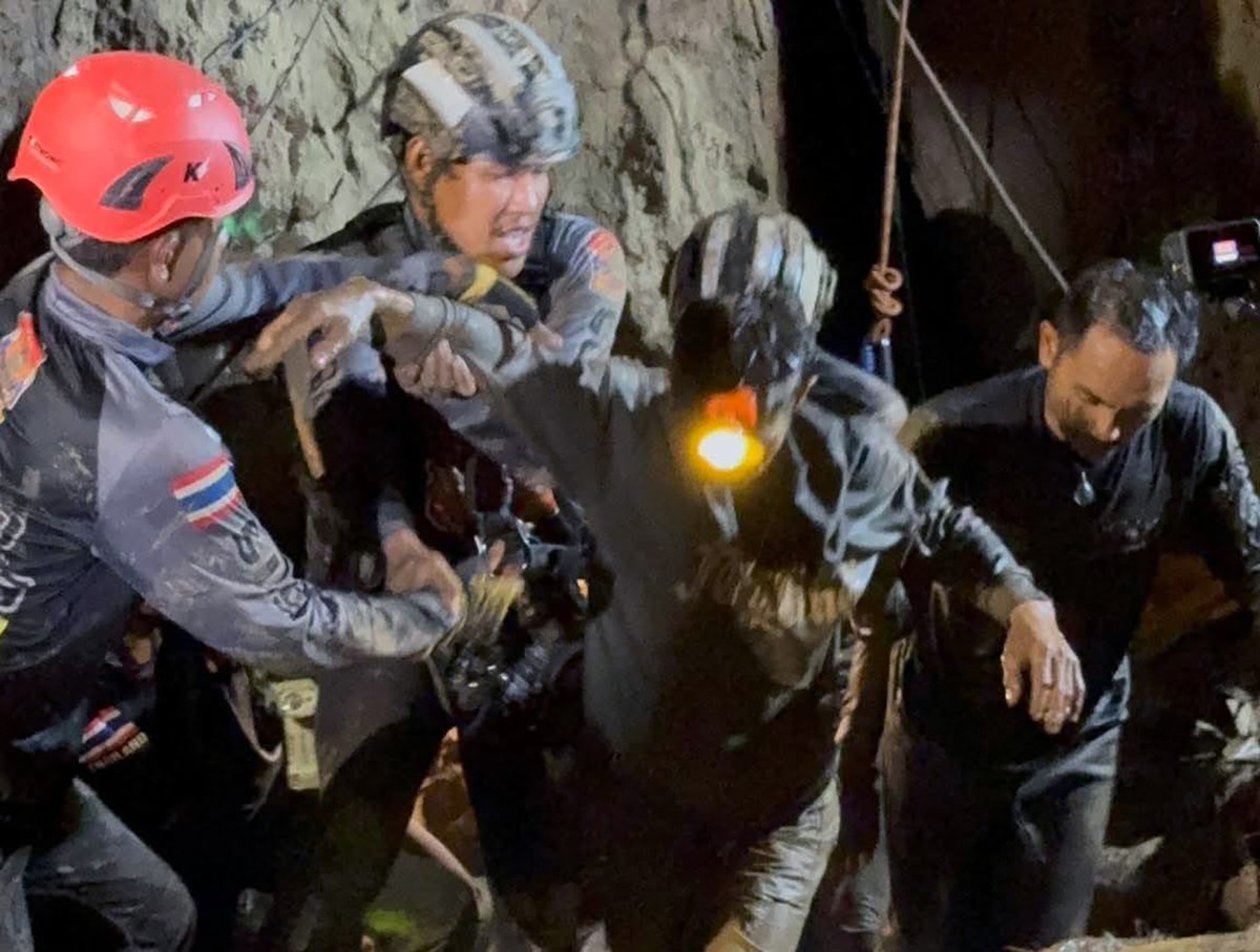 epa13002780 A handout photo made available by Metta Tham Kalasin Rescue shows a Laotian survivor rescued from a flooded cave in a mountainous area in Xaysomboun province, Laos, 29 May 2026. One of sev ...