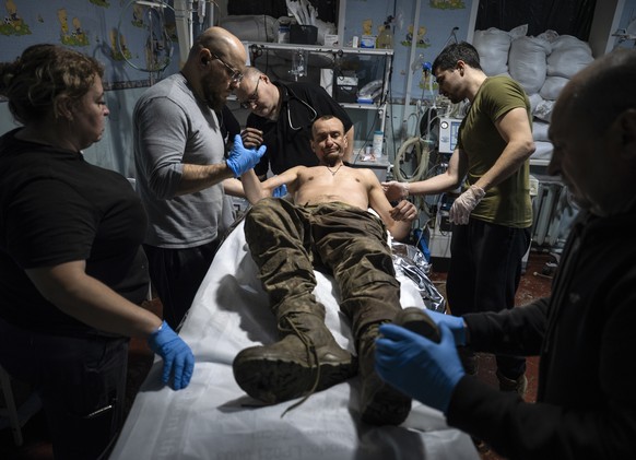 epa12519773 A handout photo made available by the press service of the 93rd Kholodnyi Yar Separate Mechanised Brigade of Ukrainian Armed Forces shows the medical staff of the 93rd Kholodnyi Yar Separa ...