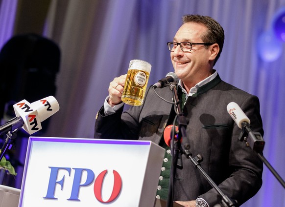 epa06525574 Heinz-Christian Strache, Austrian Vice-Chancellor and leader of the Austrian Freedom Party FPOe, holds a beer mug as he delivers a speech during the political Ash Wednesday of the FPOe in  ...