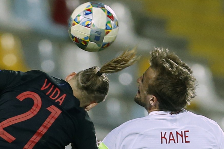 Croatia&#039;s Domagoj Vida and England&#039;s Harry Kane jumps to head the ball during the UEFA Nations League soccer match between Croatia and England at Rujevica stadium in Rijeka, Croatia, Friday, ...