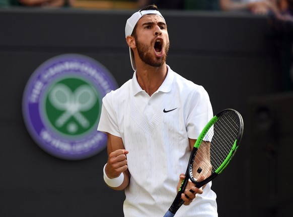 epa07692457 Karen Khachanov of Russia scores a set point winner against Feliciano Lopez of Spain during the Wimbledon Championships at the All England Lawn Tennis Club, in London, Britain, 03 July 201 ...