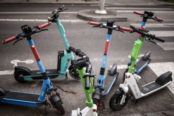 epa10553714 Self-service e-scooters parked in Paris, France, 01 April 2023. On 02 April Paris residents will be able to vote whether to ban self-service scooters in use in the city. EPA/YOAN VALAT