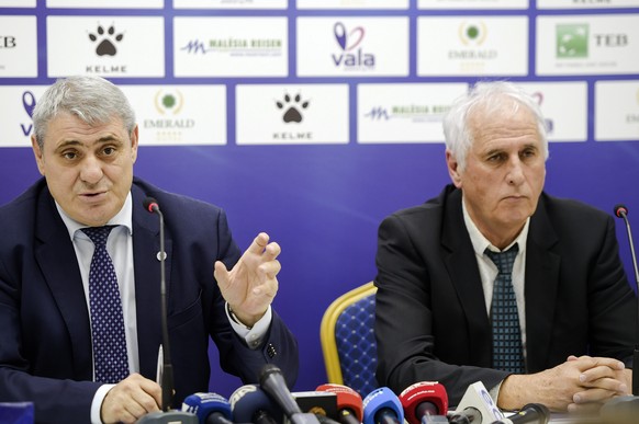 President of the Kosovo soccer Federation Fadil Vokrri, left presents newly appointed head coach of Kosovo national soccer team Bernard Challandes, during a press conference, in Pristina, Kosovo, Frid ...