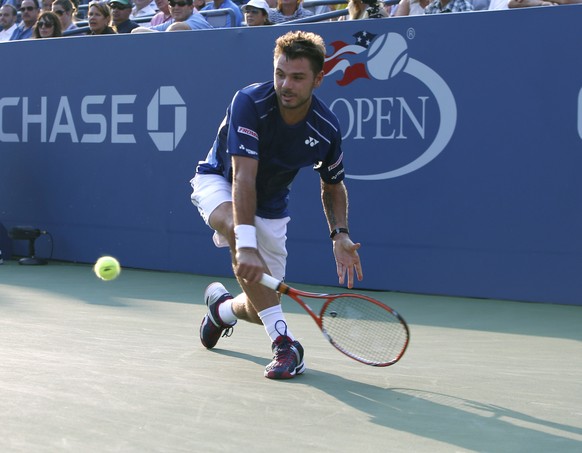 Stan Wawrinka of Switzerland returns the ball during his first round match against Albert Ramos-Vinolas of Spain at the U.S. Open tennis tournament in New York, Tuesday, Sept. 1, 2015. (AP Photo/Kathy ...