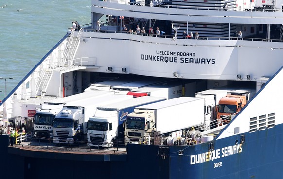 epa06920750 Trucks onboard Dunquerque Seaways ferry of DFDS as it arrives in Dover port in Dover, Britain, 31 July 2018. Reports state Dover, but also Calais in France may face serious economic proble ...