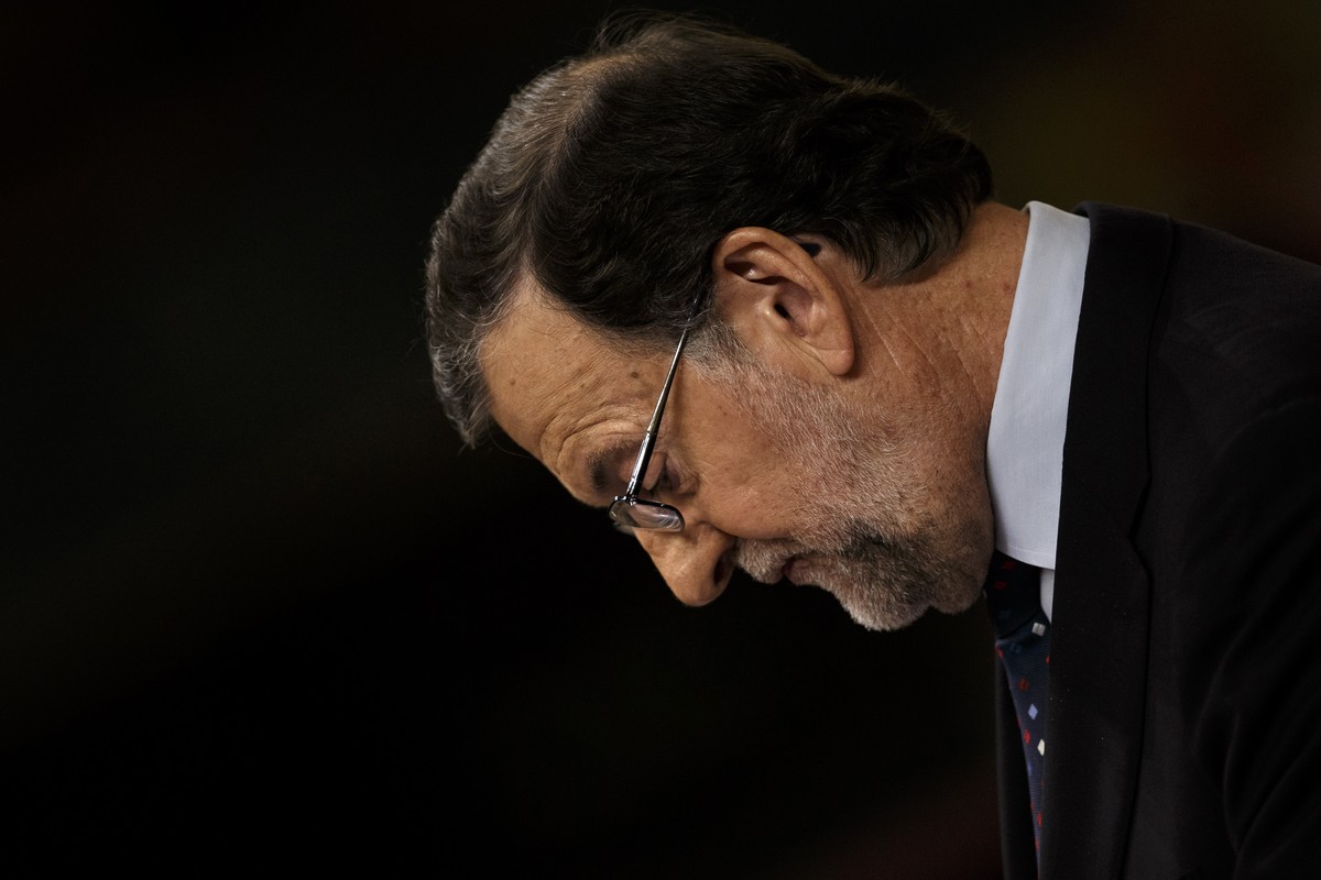 Spain's acting Prime Minister and Popular party leader Mariano Rajoy looks down as he addresses lawmakers during the second of the two investiture debates, at the Spanish parliament in Madrid, in ...