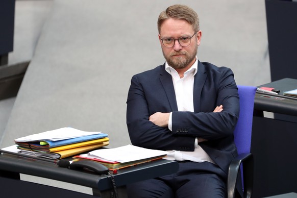 epa07368793 The member of The Left (Die Linke) party, Jan Korte, looks on after voting about the presence of the Finance Minister in the parliamentary session in Berlin, Germany, 14 February 2019. Kor ...