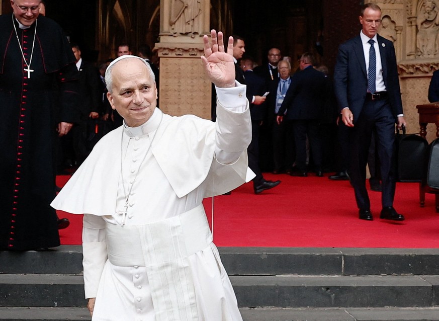 epa13268941 Pope Leo XIV waves to the crowd as he leaves at the end of a Mass at the Saint-Etienne Cathedral in Metz, France, 28 September 2026. The Pontiff arrived in Metz on the last day of his four ...
