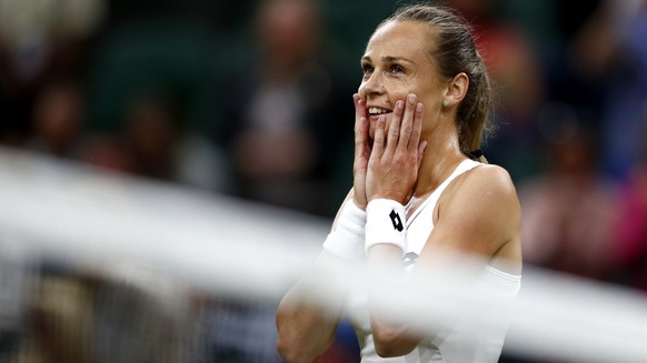 epa06081950 Magdalena Rybarikova of Slovakia celebrates winning against Coco Vandeweghe of the USA during their quarter final match for the Wimbledon Championships at the All England Lawn Tennis Club, ...